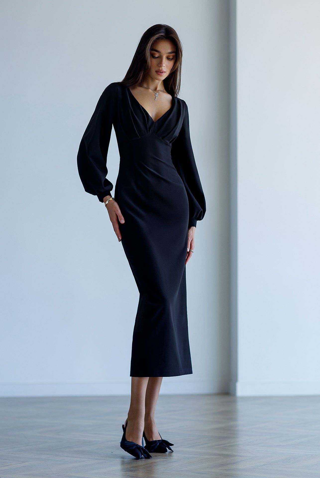 Black V-Neck Puff-Sleeve Midi Dress - close-up detail | ELAGIA