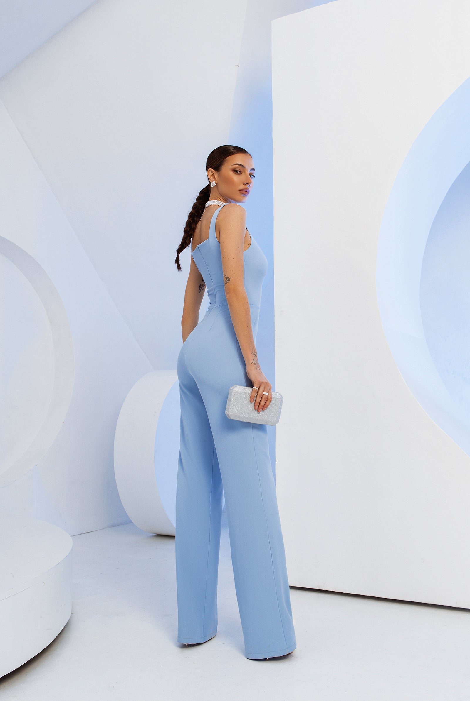 ELAGIA sky-blue sleeveless V-neck jumpsuit back view - light blue suit women rear styling and fit
