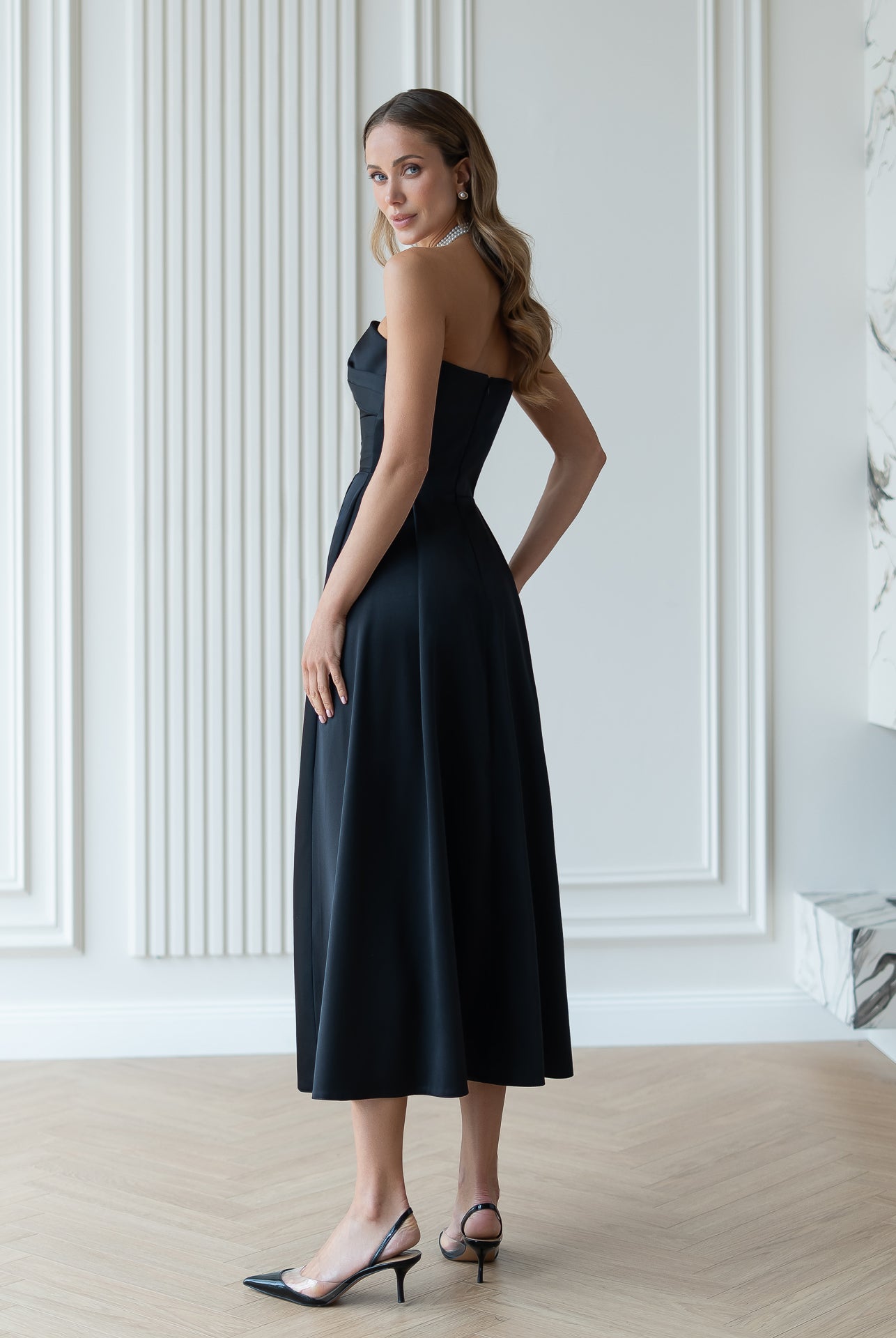 Nova Black Satin Strapless Sweetheart Midi Dress - side view | ELAGIA