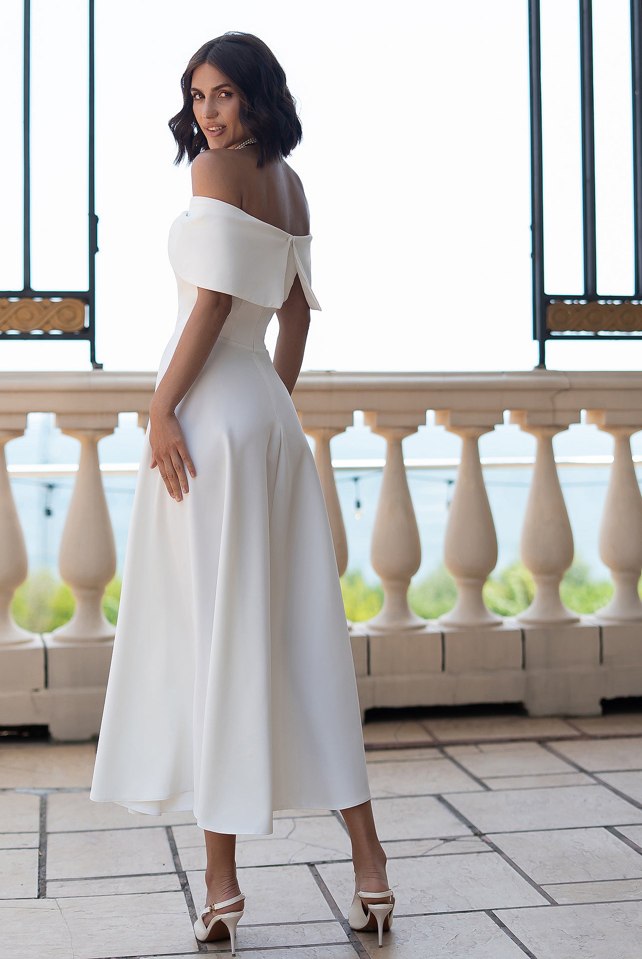 Céline White Off-Shoulder Draped-Bow Midi Dress - side view | ELAGIA