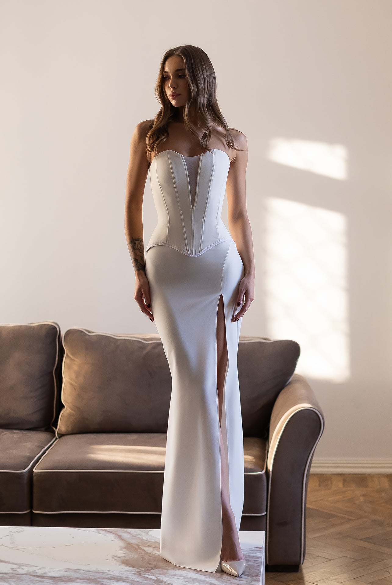 ELAGIA Selina white corset top & high-slit maxi skirt 2-piece set front view, white women suit style