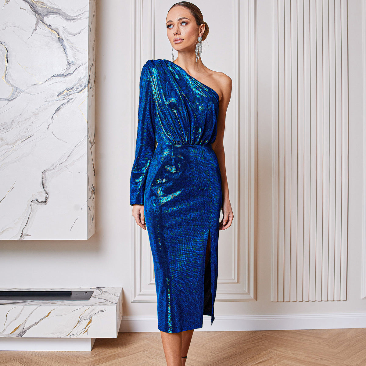 Woman in a midnight blue sequin midi dress
