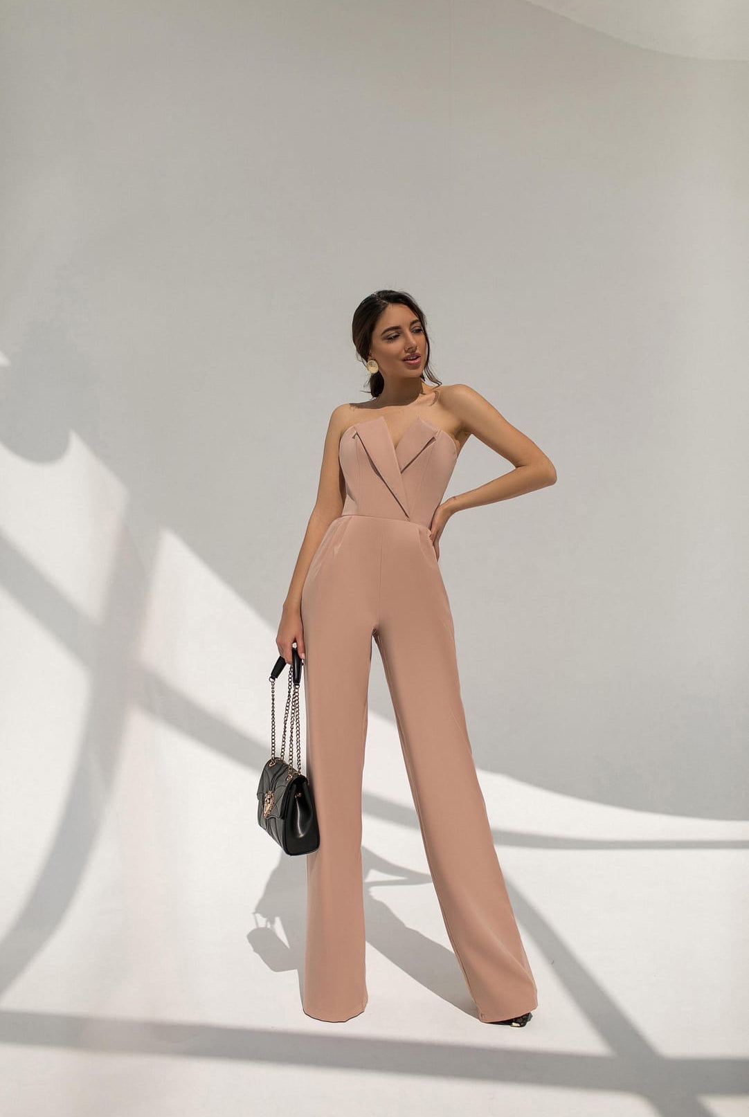 ELAGIA beige v-neck sleeveless jumpsuit styled outfit featuring blue jumpsuit casual-chic summer look