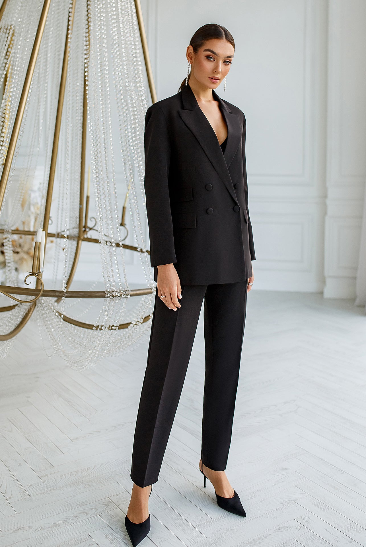 ELAGIA black double-breasted suit close-up of fabric texture and tailoring details on blazer and pants