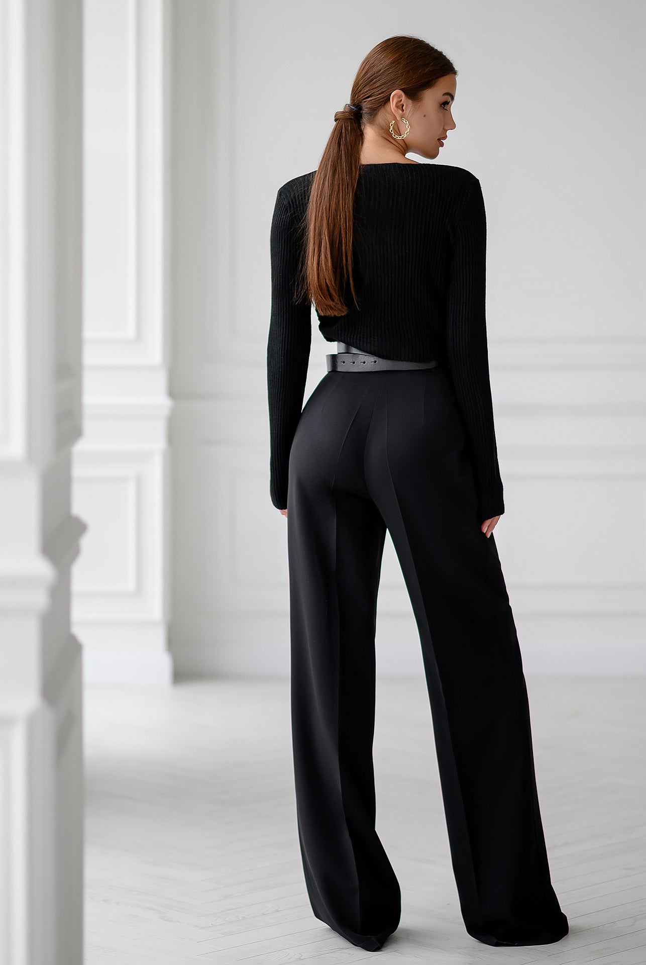 ELAGIA Black Ribbed-Knit Wrap Crop Top lifestyle shot on model - women's black suit set ribbed knit top