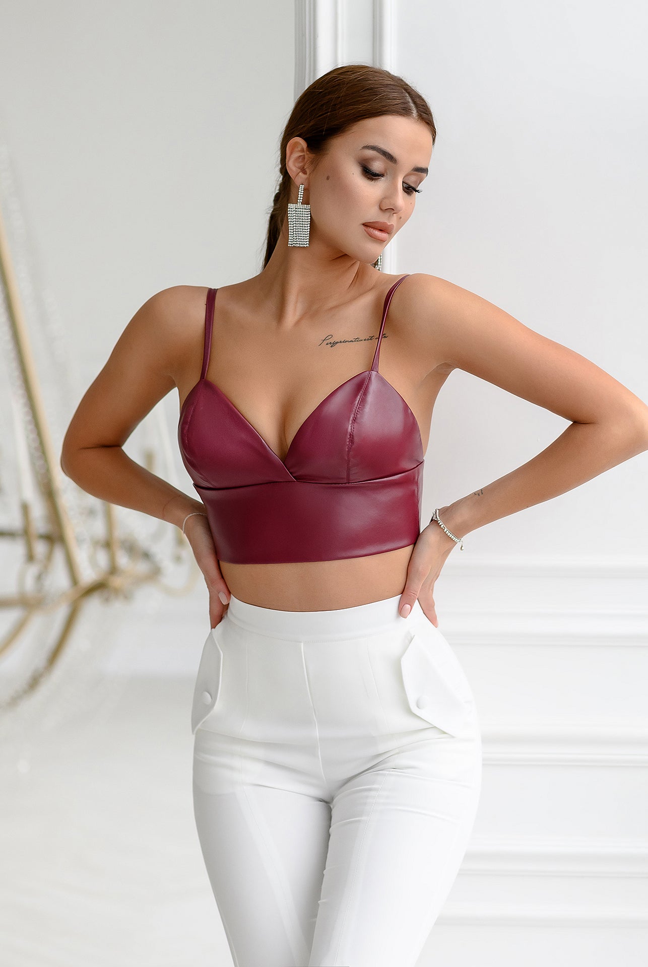 ELAGIA vegan crop tops in rich bordeaux styled on model, showcasing fit and red leather finish