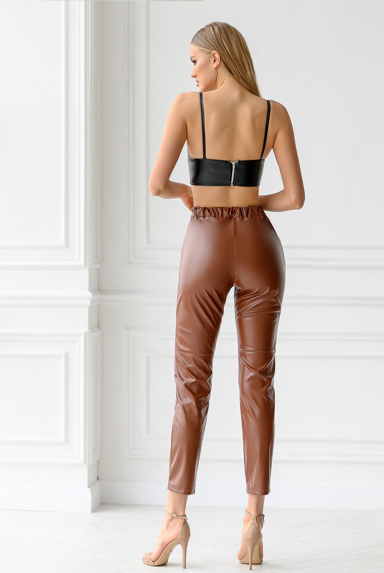 ELAGIA Black Vegan Leather Crop Top side profile - fitted womens black suit piece with structured shoulders