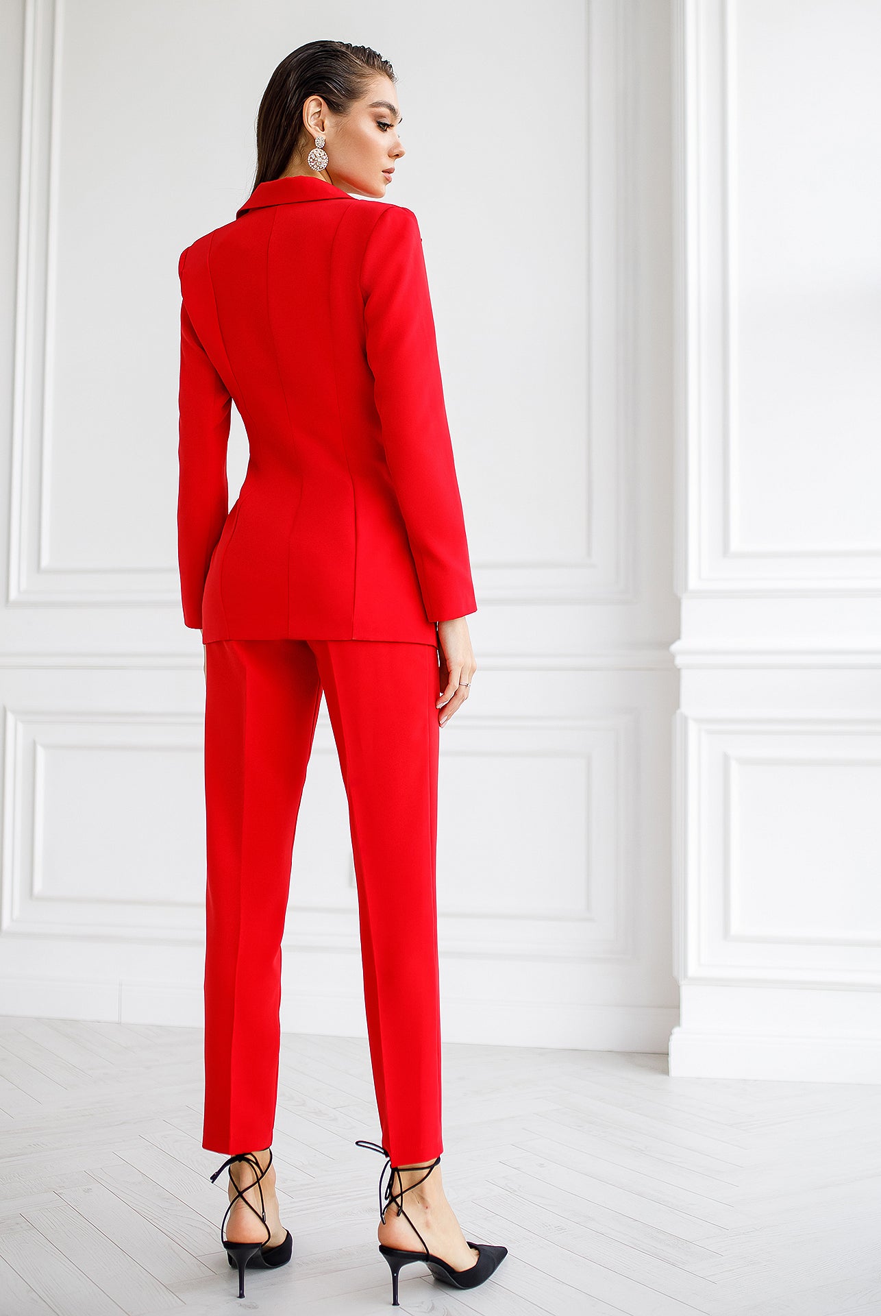 ELAGIA red women's business suit back view showing tailored blazer and matching trousers silhouette