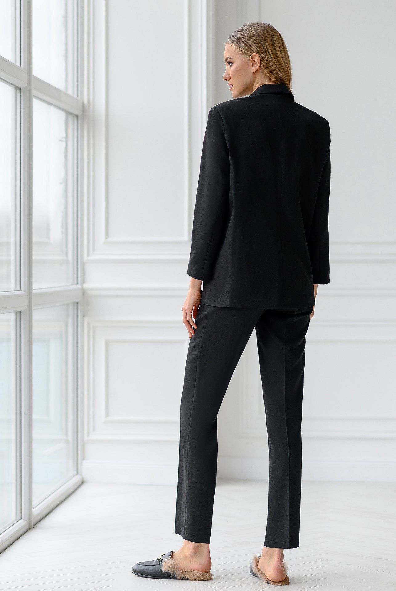 ELAGIA black double-breasted suit fabric texture close-up showing quality material and craftsmanship