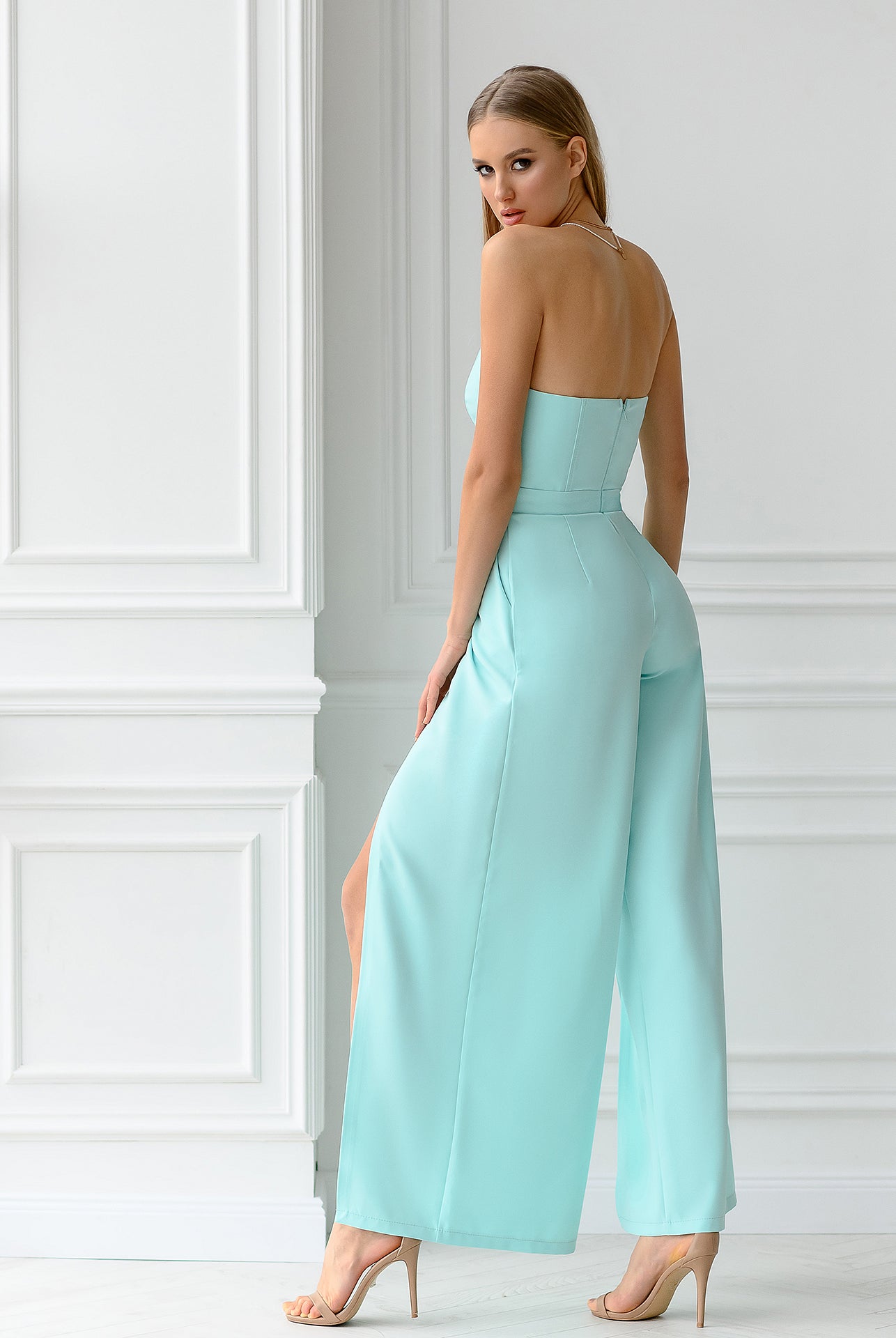 ELAGIA blue jumpsuit detail shot highlighting v-neckline and tailored bodice of mint strapless jumpsuit