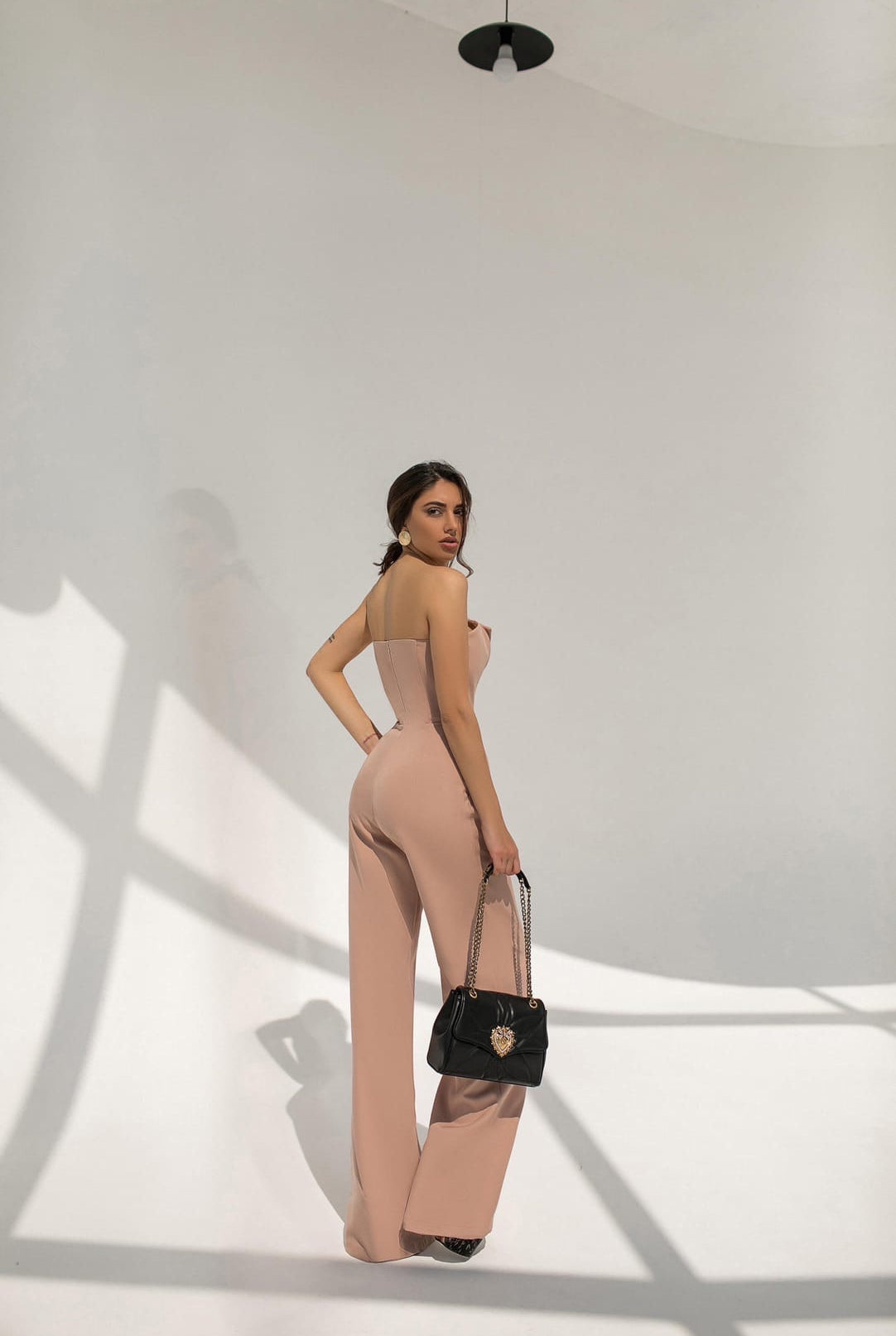 ELAGIA beige v-neck sleeveless jumpsuit close-up of blue jumpsuit wide-leg pants and sleeveless bodice