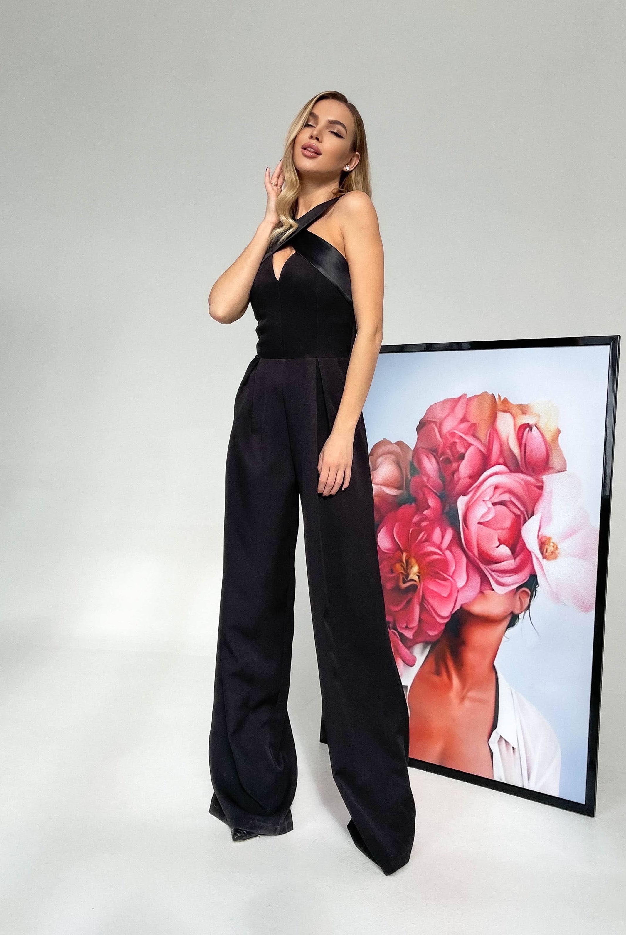 ELAGIA women's black suit set lifestyle shot - Black Cross-Neck Sleeveless Jumpsuit modeled