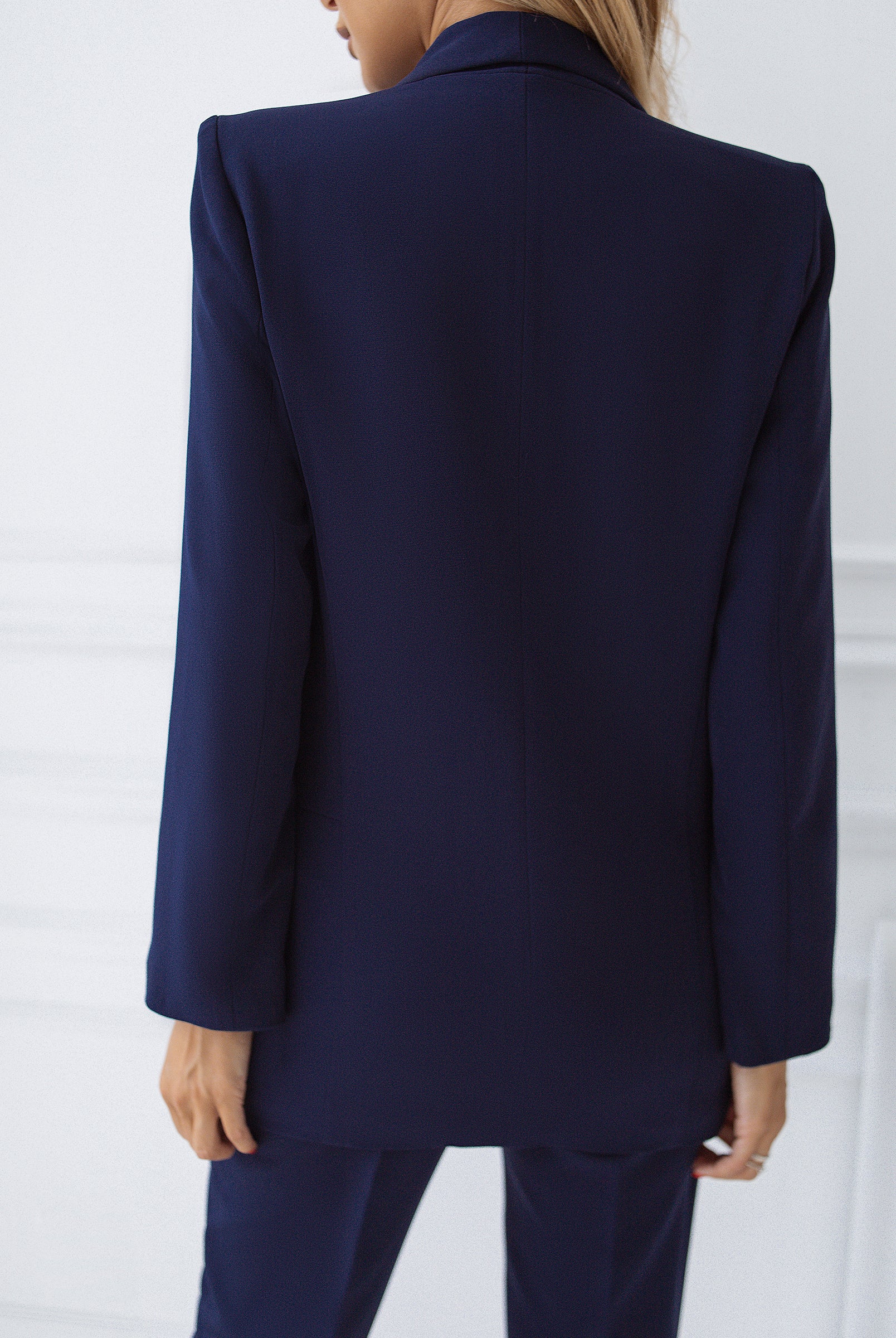 ELAGIA navy suit detail shot of shawl lapel collar and button closure - 3 piece women's suit styling option