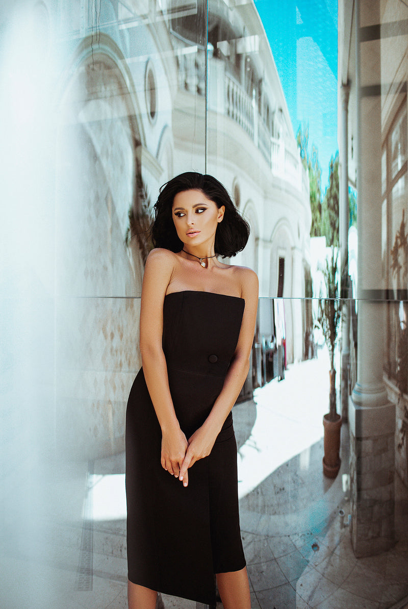 ELAGIA black strapless asymmetric cocktail dress back view displaying elegant draping and sophisticated cut