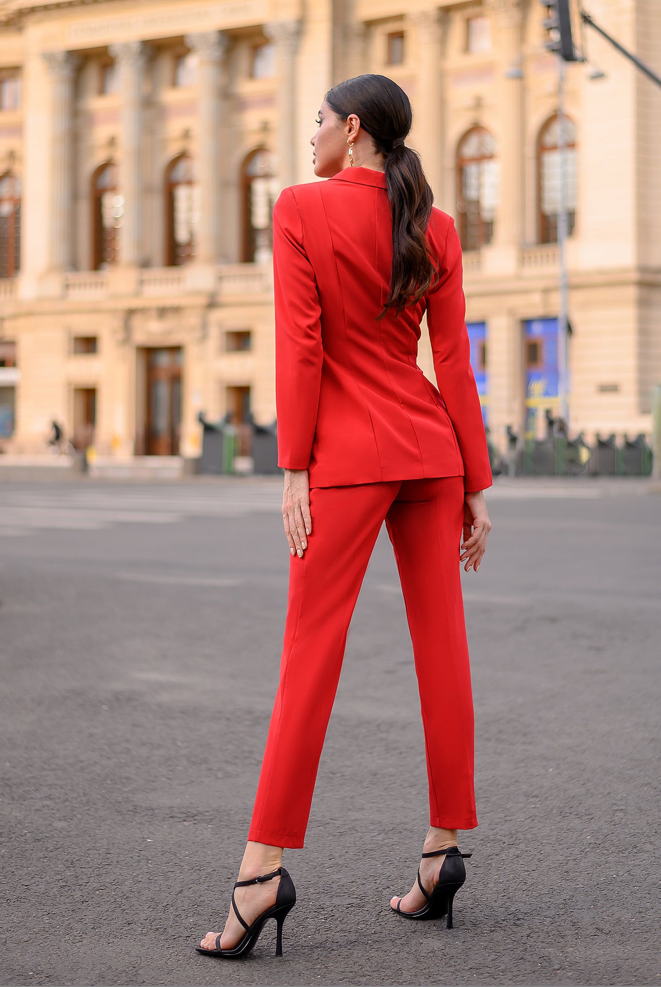 ELAGIA red 2-piece suit styled with accessories showing complete professional women's outfit look