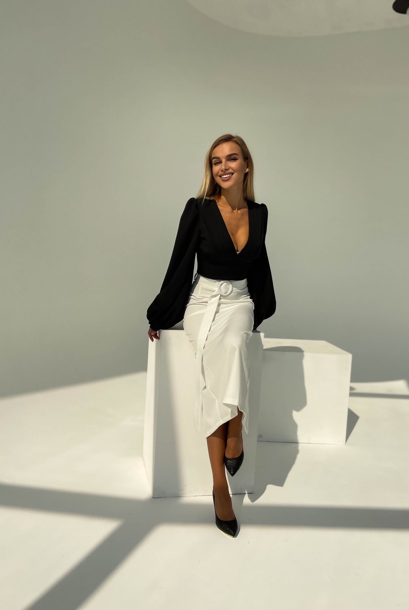 ELAGIA white high waist pencil skirt close-up texture shot of womens white suit fabric and finishing details