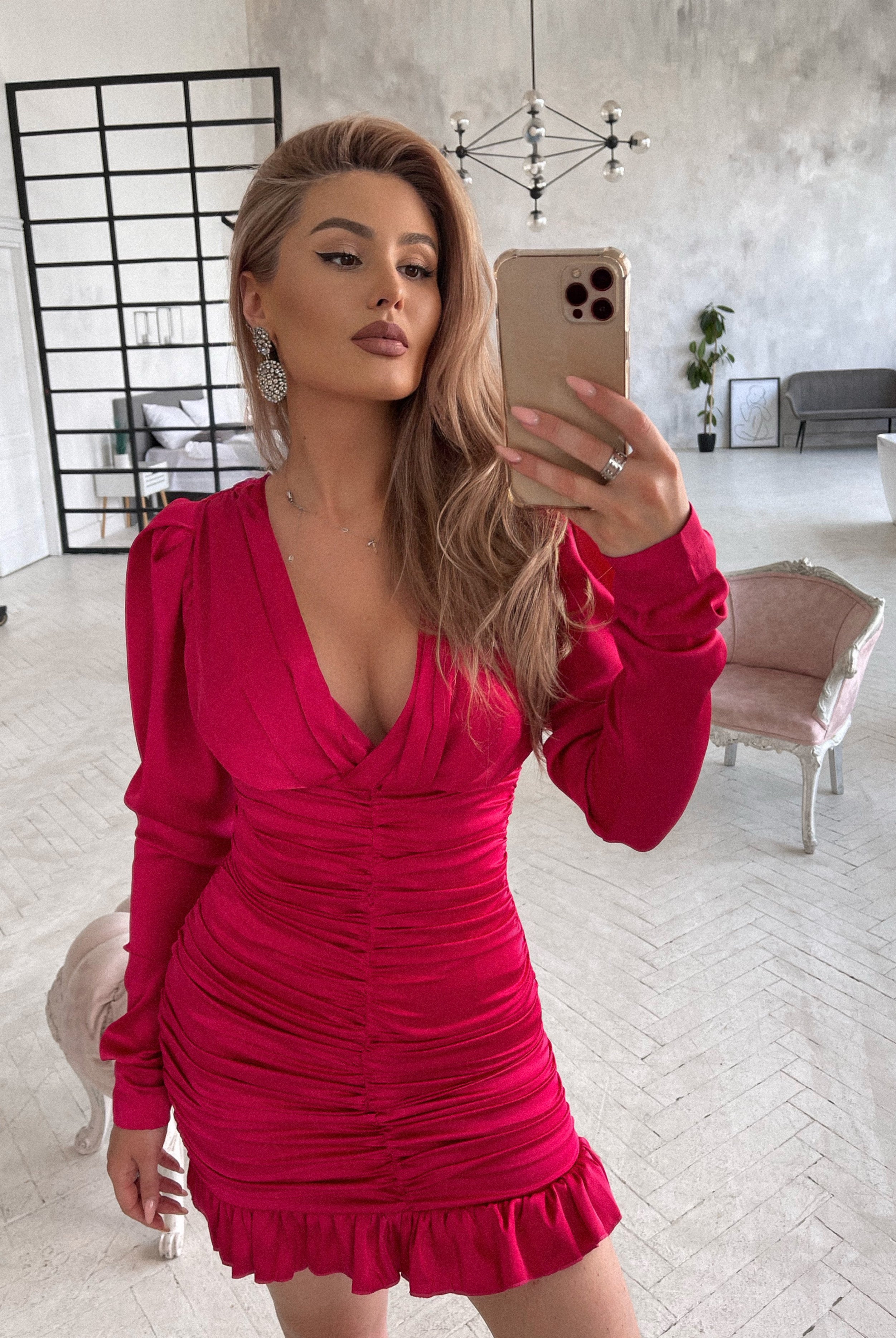 ELAGIA Crimson Silk Long Sleeve Ruched Mini Dress - angled view emphasizing ruched side panel design details