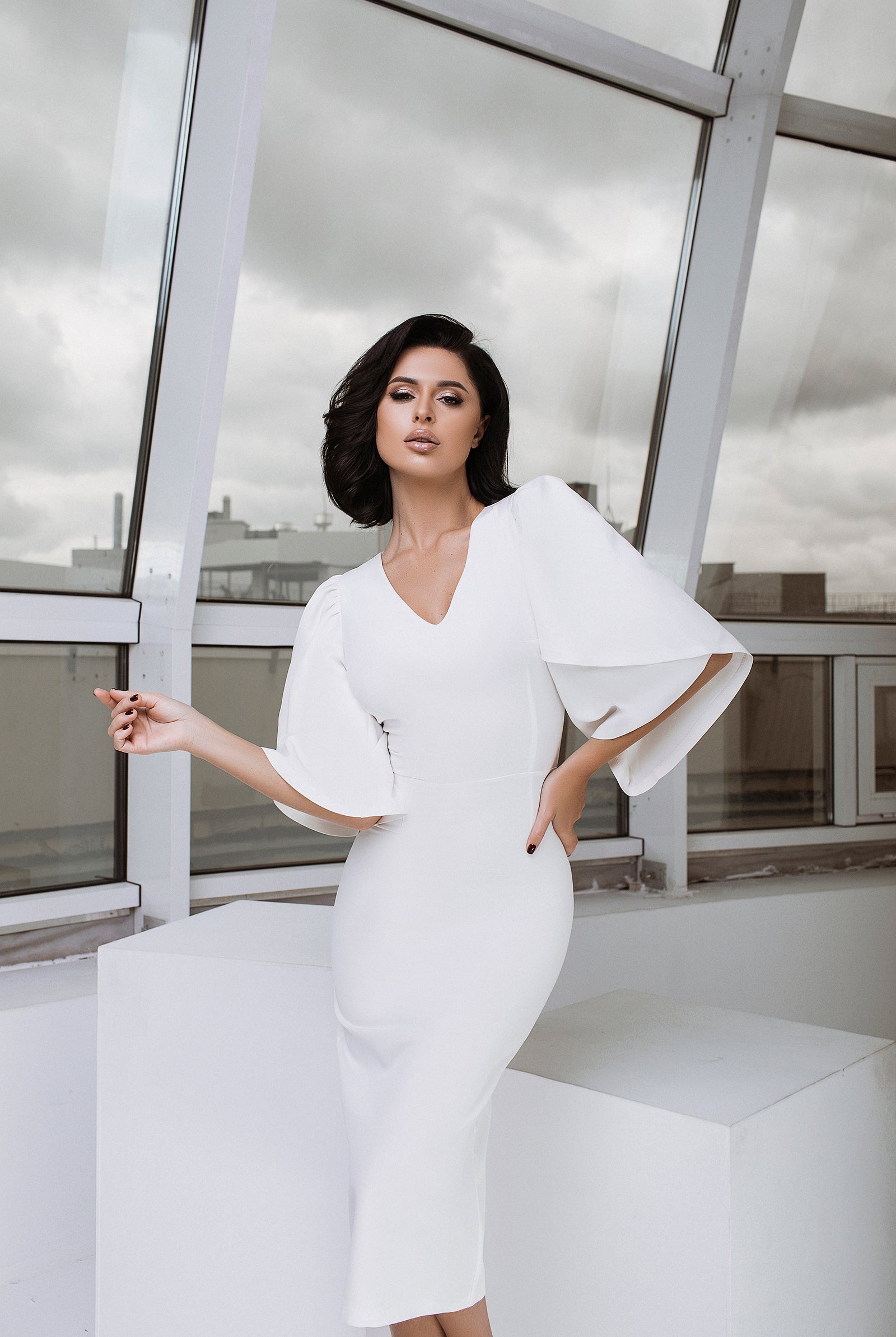 ELAGIA white V-neck bell sleeve midi dress side angle showing purple business suit women inspired design