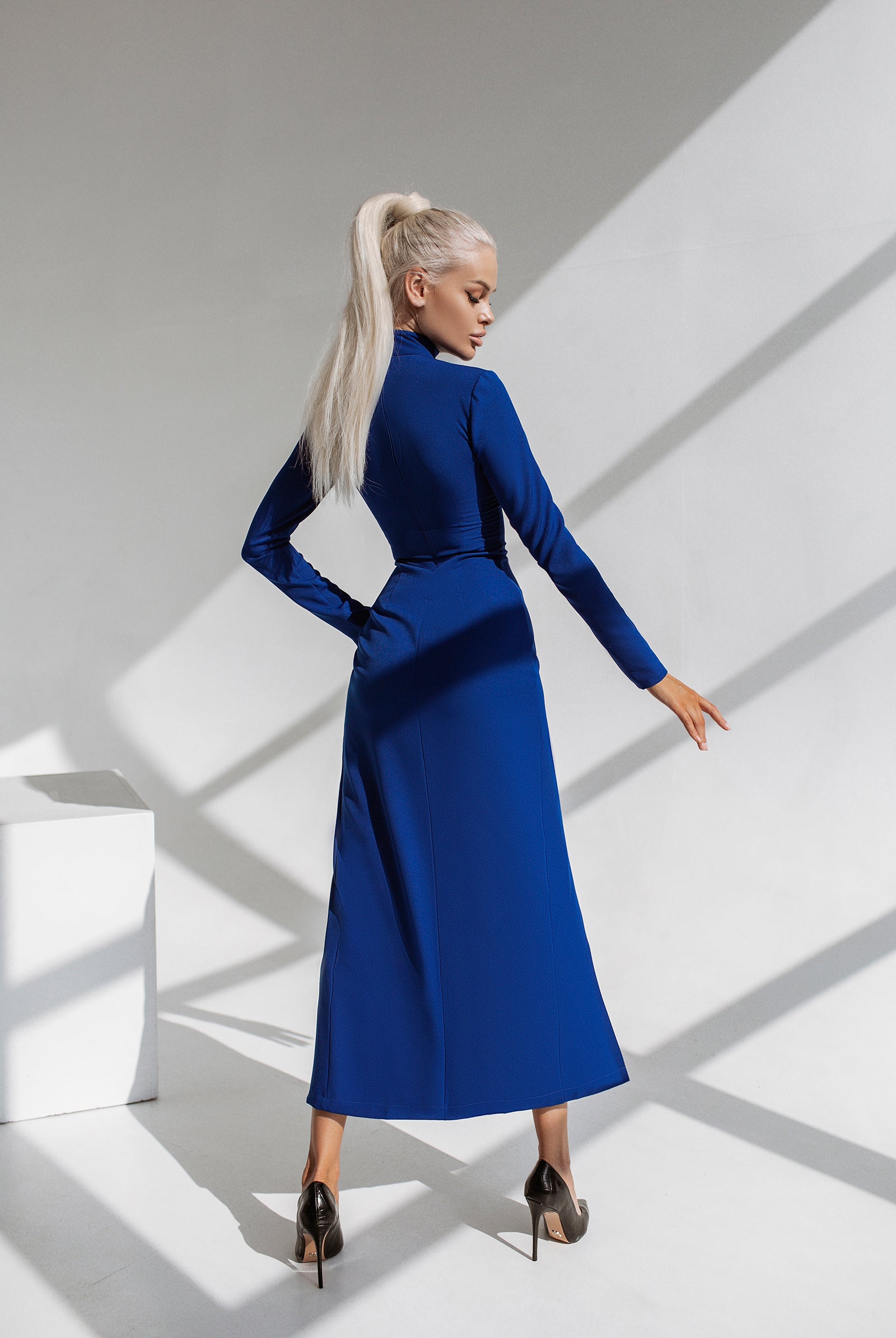 ELAGIA Navy High Neck Side-Slit Midi Dress - lifestyle shot of purple business suit women professional dress