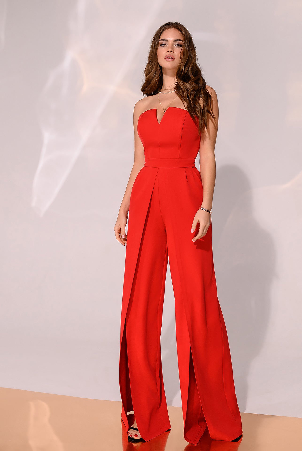 ELAGIA coral strapless v-neck jumpsuit front view - elegant coral jumpsuit with flattering silhouette