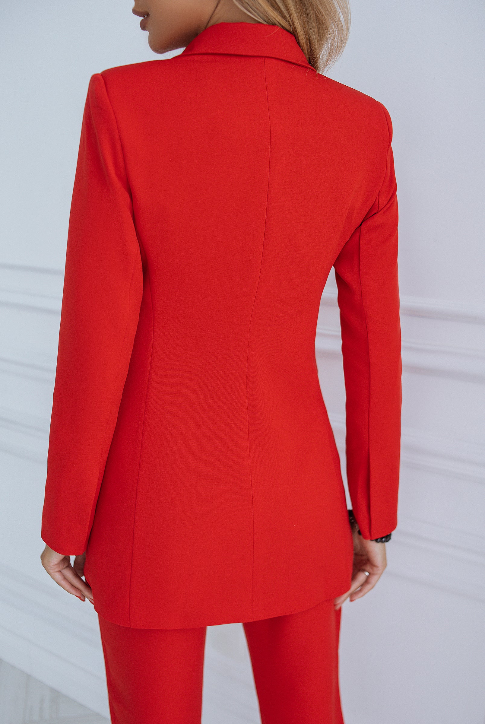 ELAGIA red double breasted suit back view showing tailored fit of women's business blazer and matching trousers