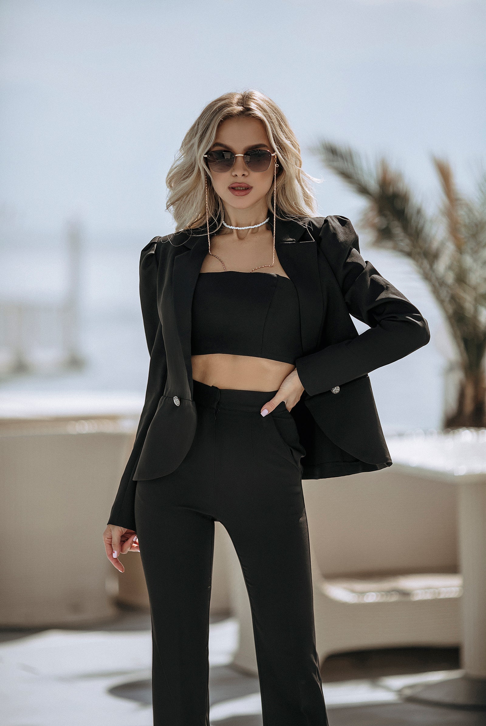 ELAGIA black 2-piece suit detail shot showing button and lapel construction of 3 piece women's suit