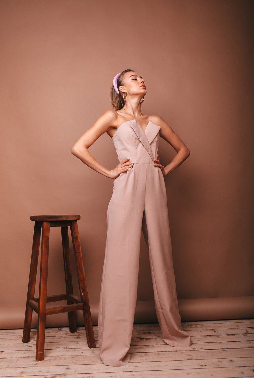 ELAGIA beige V-neck sleeveless jumpsuit side angle - blue jumpsuit profile showing drape and tailoring