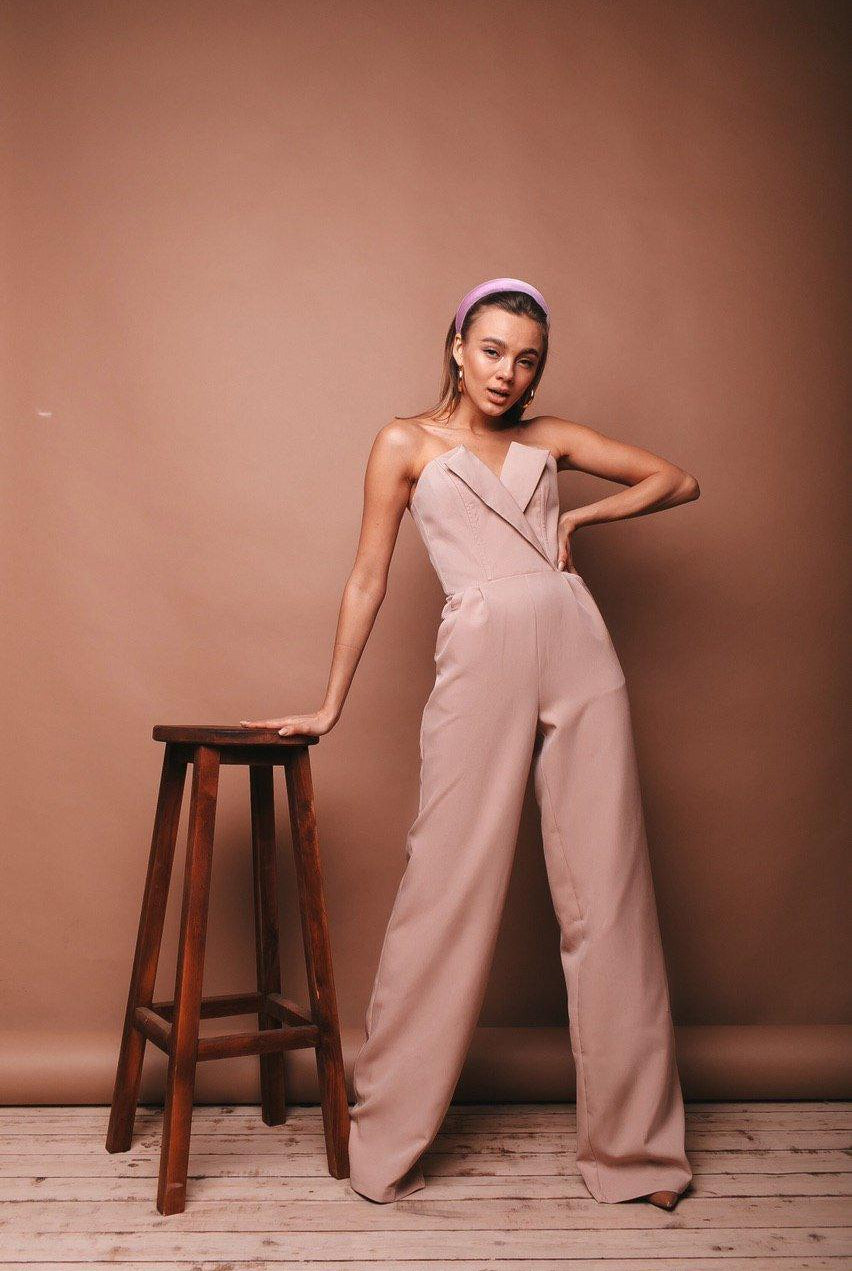 ELAGIA beige V-neck sleeveless jumpsuit fabric swatch - blue jumpsuit material sample showing color and weave