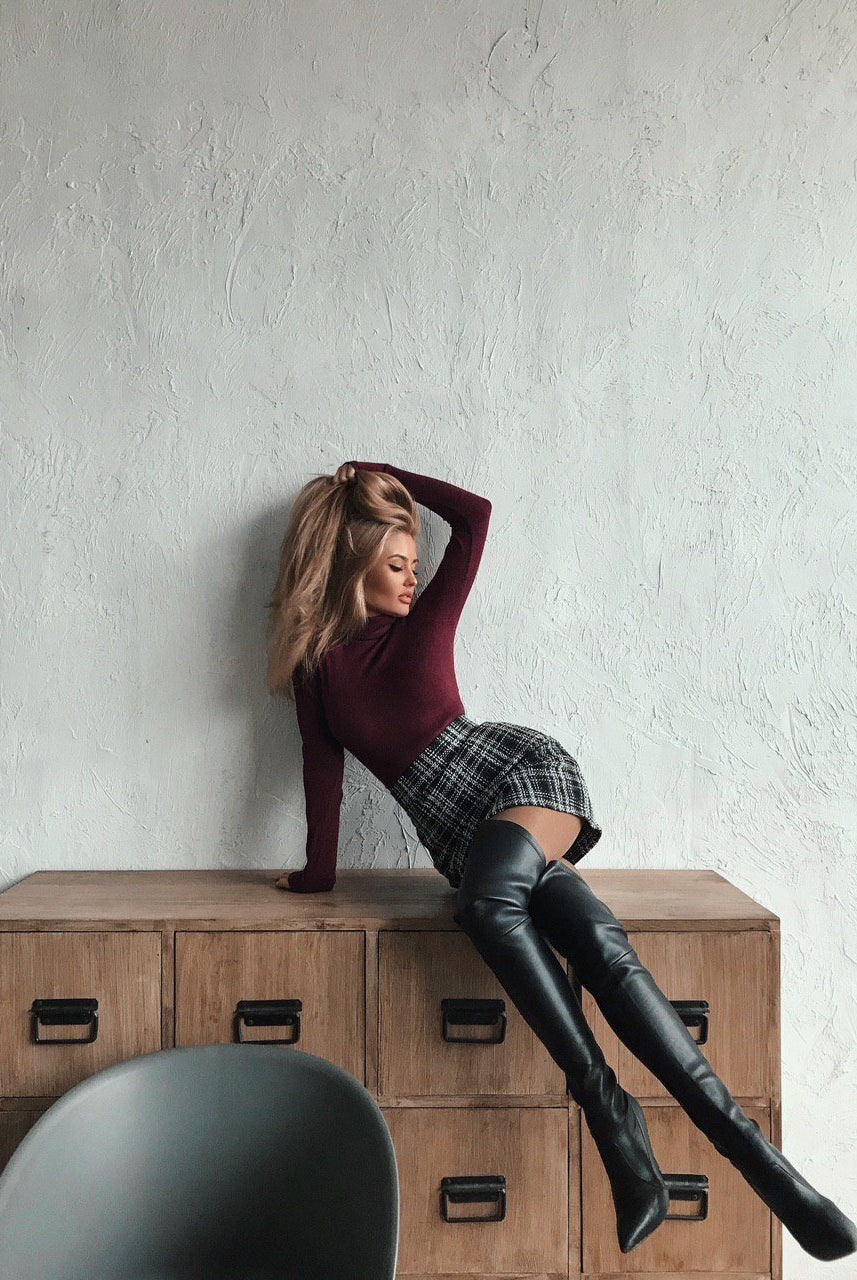 ELAGIA plaid tweed mini skirt lifestyle shot featuring grey plaid mini skirt in outfit coordination