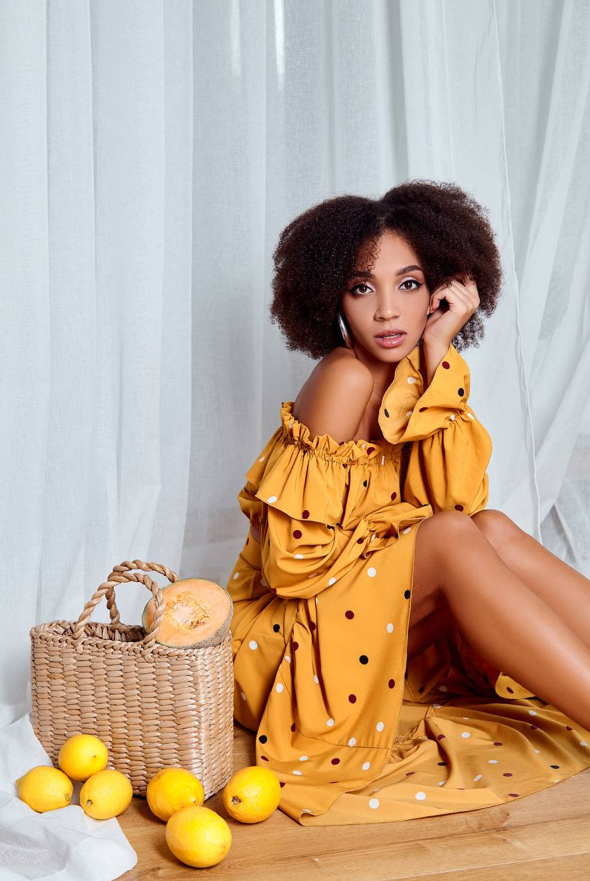 ELAGIA mustard polka dot suit set back view showing flowing maxi skirt and cropped top 3 piece women's suit