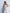 ELAGIA beige satin corseted strapless dress side angle view with purple business suit women tailored influence