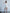 ELAGIA Ivory Backless Puff Sleeve Mini Dress - lifestyle styled shot with 3 piece women's suit professional appeal