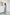 ELAGIA sky-blue sleeveless top and wide-leg pants set, back view showing flowing silhouette and tailored fit