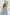 ELAGIA sky-blue wide-leg pants detail view emphasizing flowy silhouette and tailored waistband construction