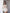Beige tweed peplum blazer and mini skirt set – showing back silhouette with fitted waistline detail