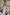 ELAGIA sky-blue sleeveless V-neck jumpsuit detail shot showing fabric texture - light blue suit women