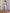 Monica Lavender Satin V-Neck Puff Sleeve Midi Dress - side view | ELAGIA