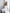 White Satin V-Neck Asymmetric Ruffle Midi – close-up detail of ruffle texture and v-neckline construction
