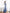 Sky-blue satin v-neck asymmetric ruffle midi wrap – back view displaying elegant draping detail