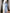 Sky-blue collarless gold-button single-breasted two-piece – crepe fabric, front view