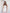 White satin strapless peplum maxi – structured corset and flowing skirt, side angle