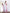 Dusty-pink satin asymmetric ruffle midi wrap – back view showing drape