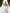 White corset top and high-slit maxi skirt 2-piece set in crepe, side view showing slit