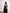 Black satin strapless peplum sheer skirt maxi with corseted bodice, side view