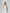 Gloria White Open-Back Halter-Neck Midi Dress - back view | ELAGIA
