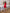 Inès Red Sleeveless Ruffled-Hem Mini Dress - close-up detail | ELAGIA
