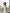 Céline White Off-Shoulder Draped-Bow Midi Dress - back view | ELAGIA