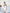 White Strapless V-neck Asymmetric Mini Dress - side view | ELAGIA