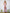 ELAGIA dusty pink strapless v-neck jumpsuit styling shot - hot pink suit womens paired with accessories