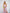 ELAGIA dusty pink strapless v-neck jumpsuit model wearing - hot pink suit womens shown in lifestyle setting